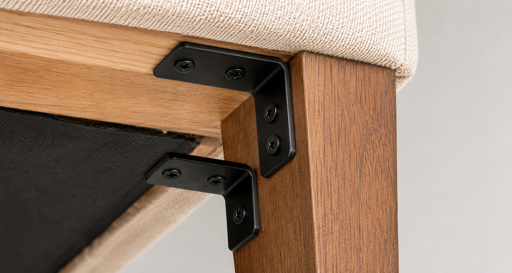 Angle bracket mounted sofa leg attachment