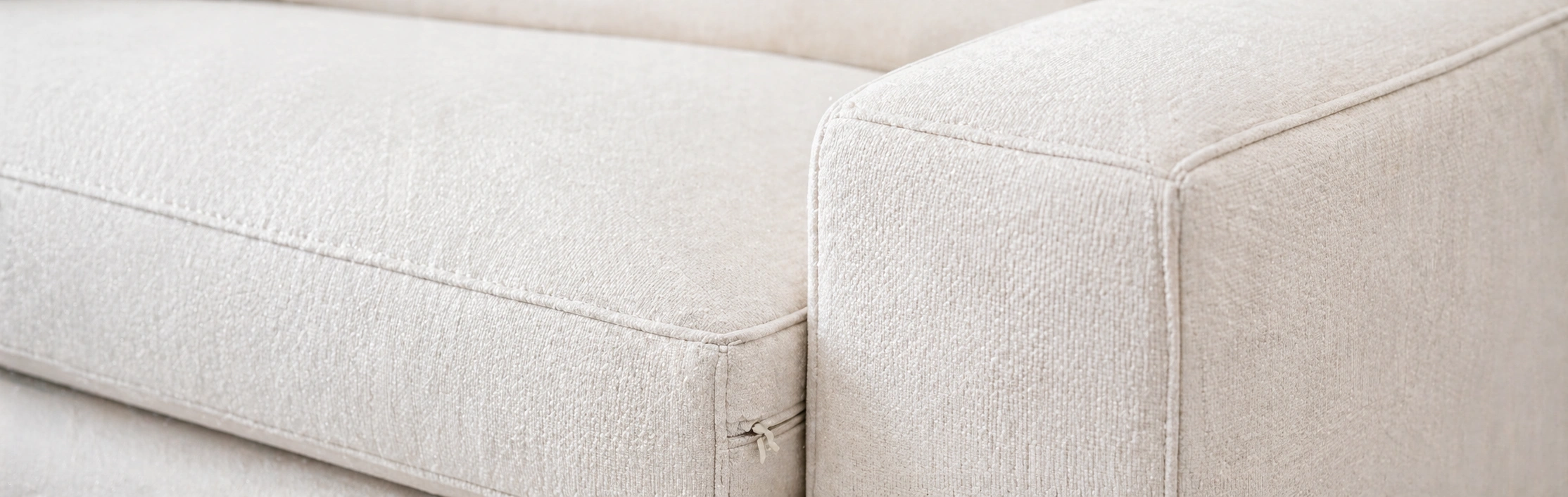 Detail shot showing clean stitching and low arm profile of a cloud couch