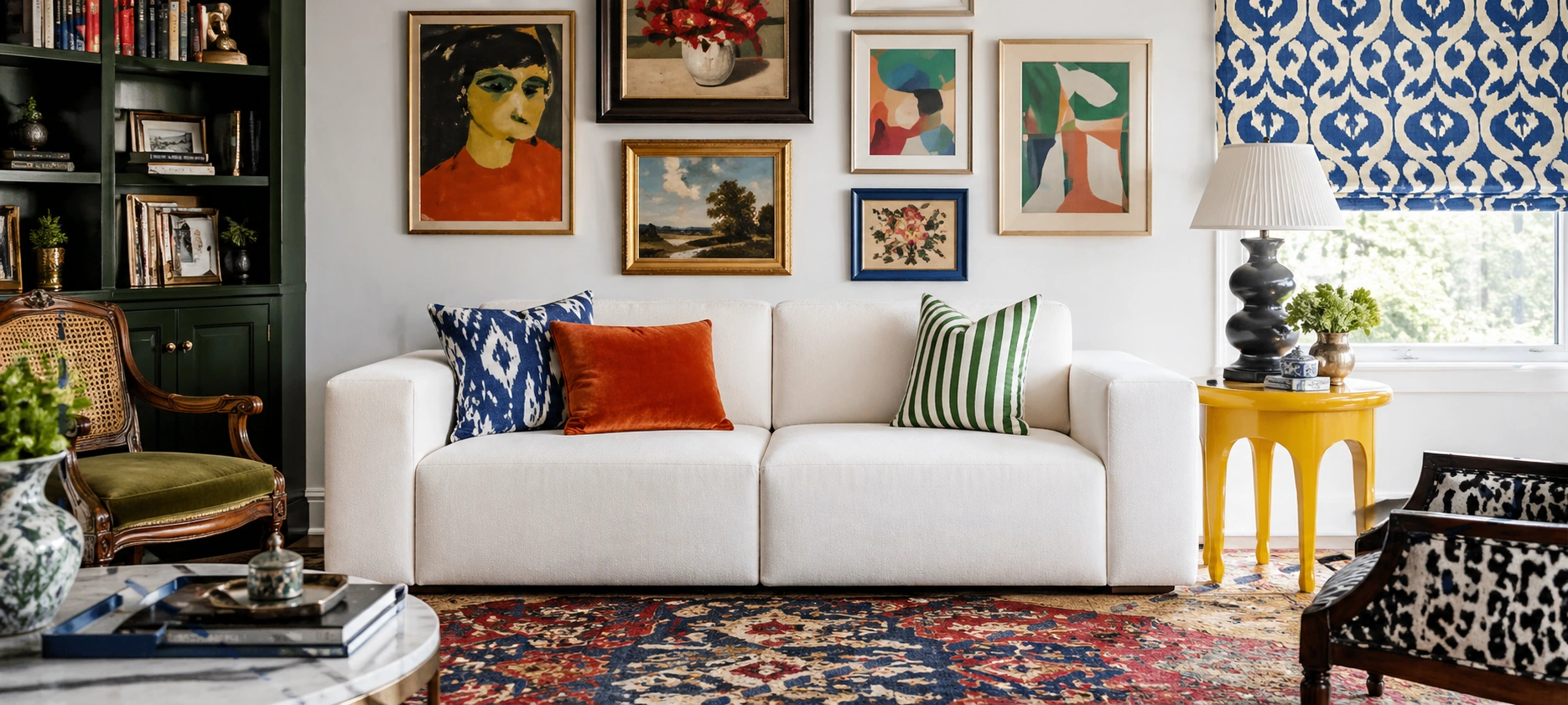 Cloud couch styled in an eclectic room with bold art and patterns