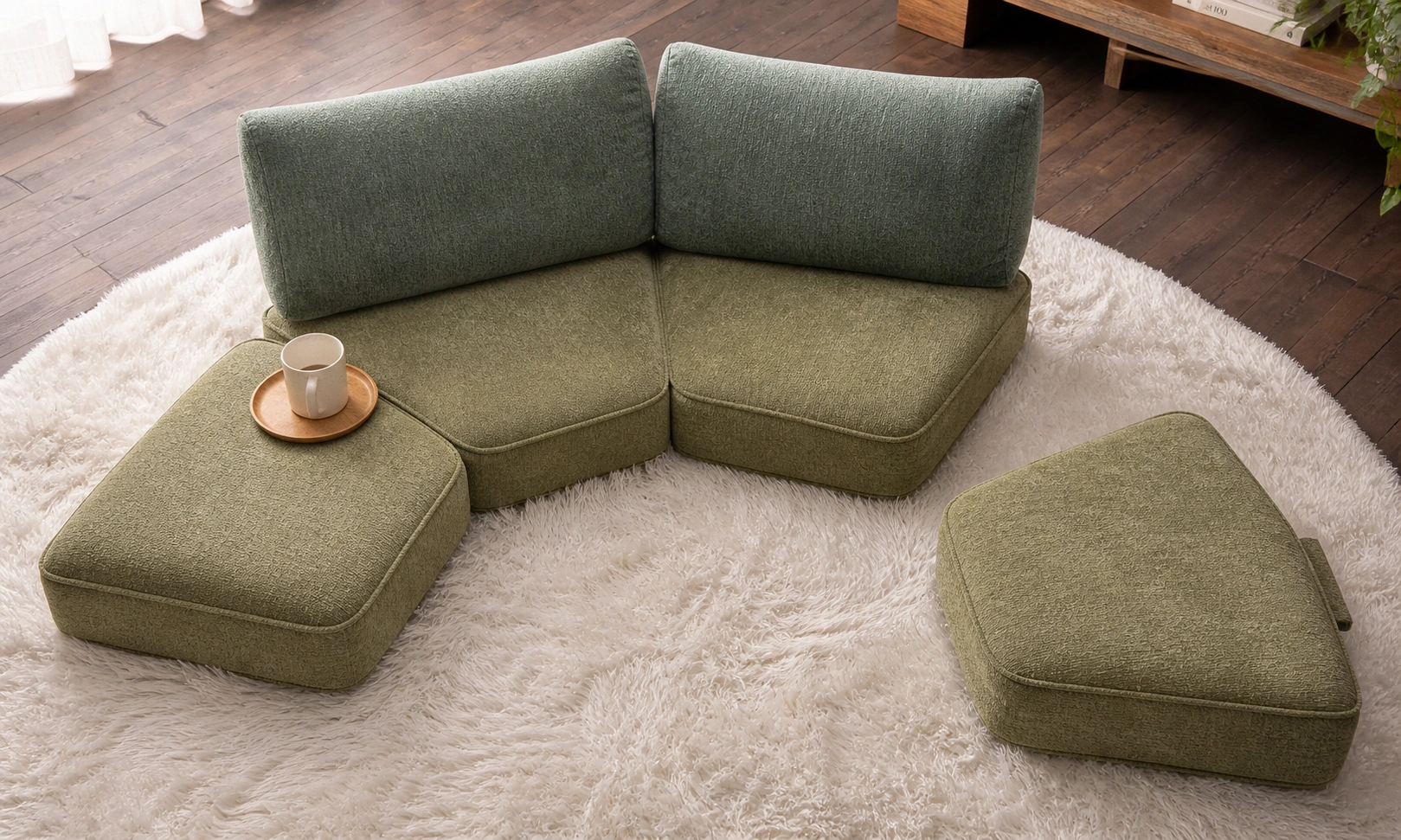 Cushion-style floor sofa with modular pieces arranged together