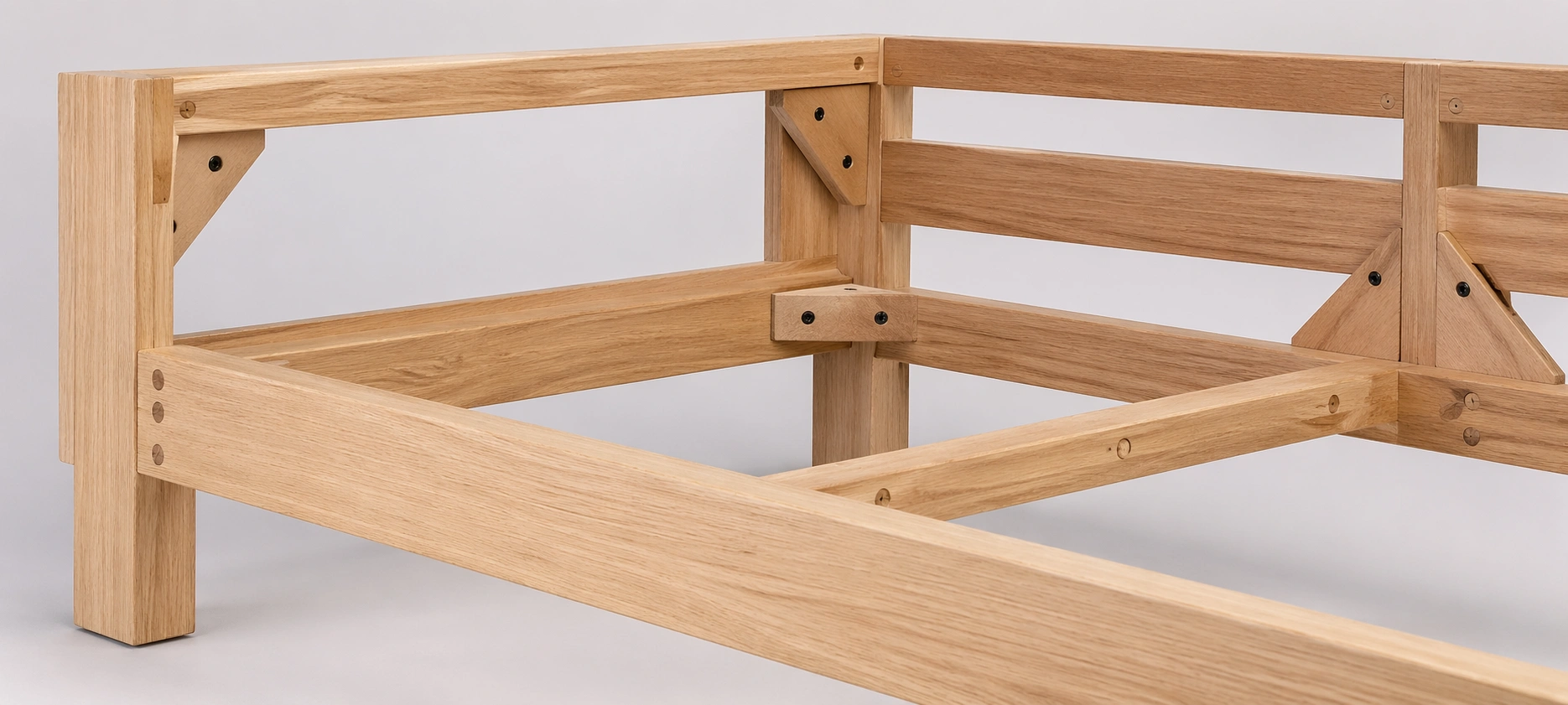 Kiln-dried hardwood sofa frame showing solid oak construction with corner blocks