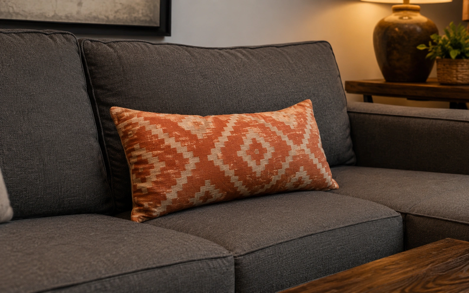 Lumbar throw pillow placed on a sectional sofa for lower back support