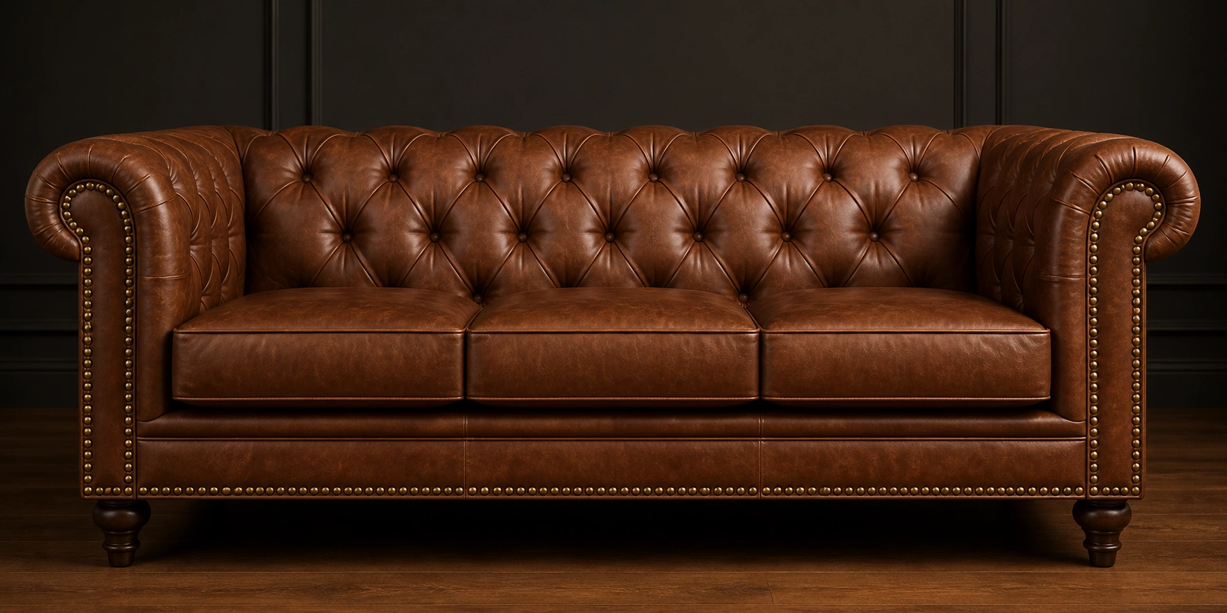 Nailhead trim tufted sofa with decorative metal studs along edges