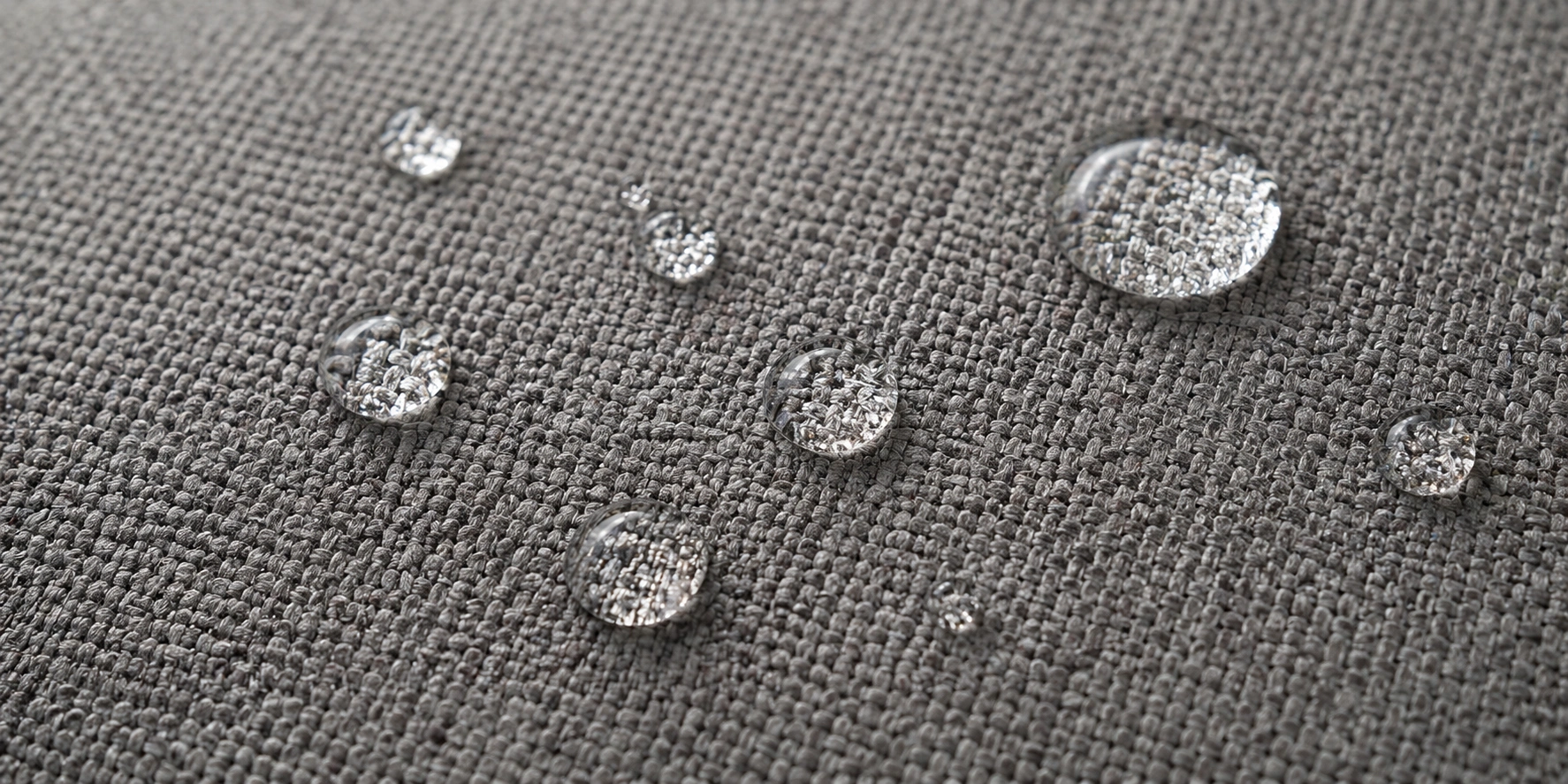 Close-up of stain-resistant performance fabric on a family sofa