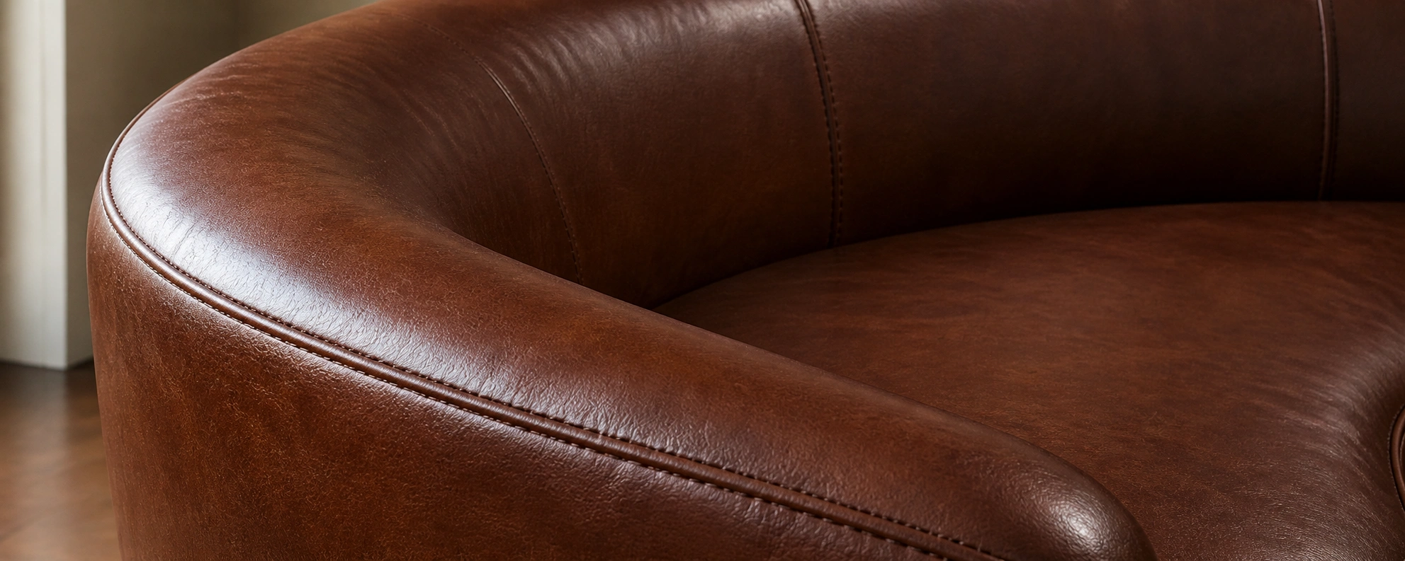 Round leather sofa in brown with smooth finish