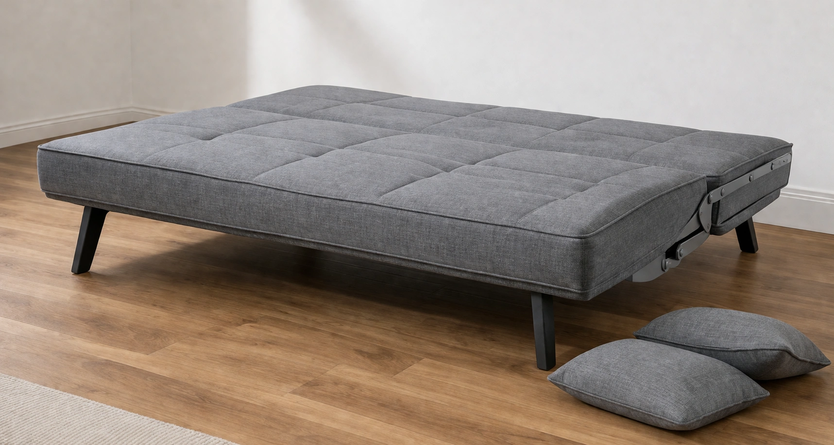 Click-clack sleeper sofa folded into bed position