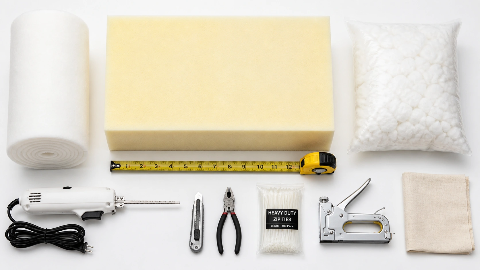 Tools and materials needed for fixing sagging sofa cushions including foam, poly-fill, and cutting tools