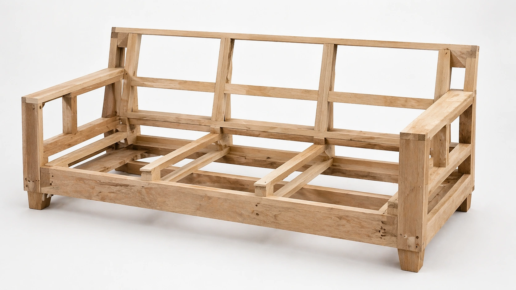 Internal structure of a sofa frame showing wooden rails and joints