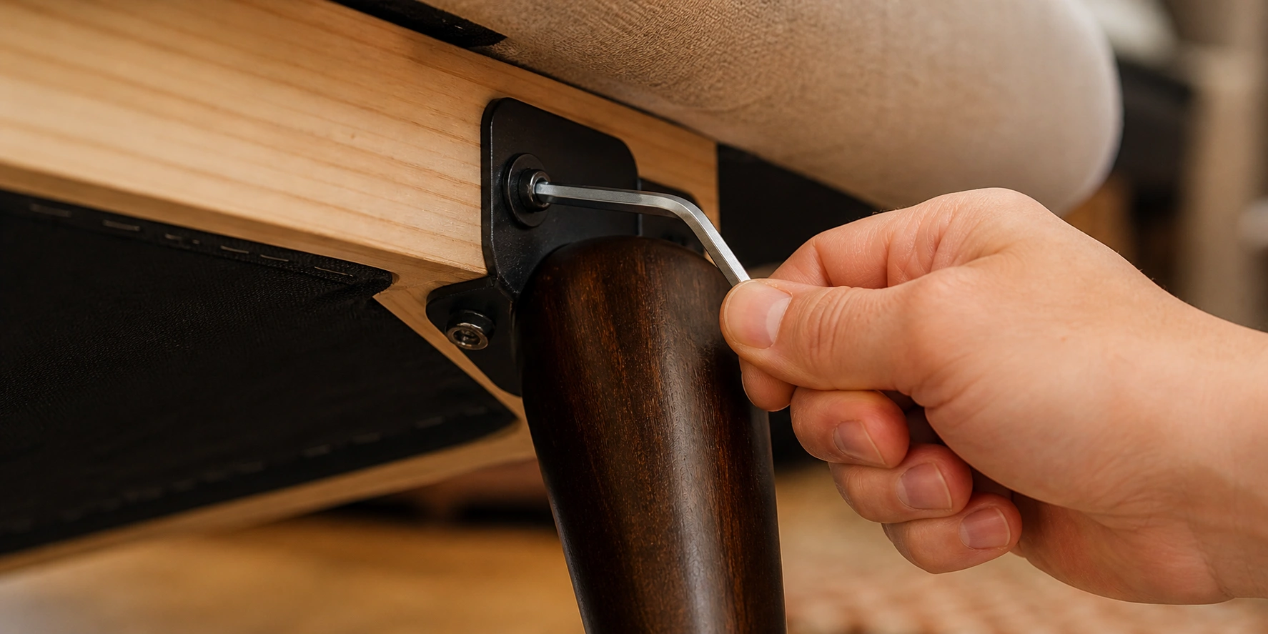 Tightening sofa leg bolts with an Allen wrench
